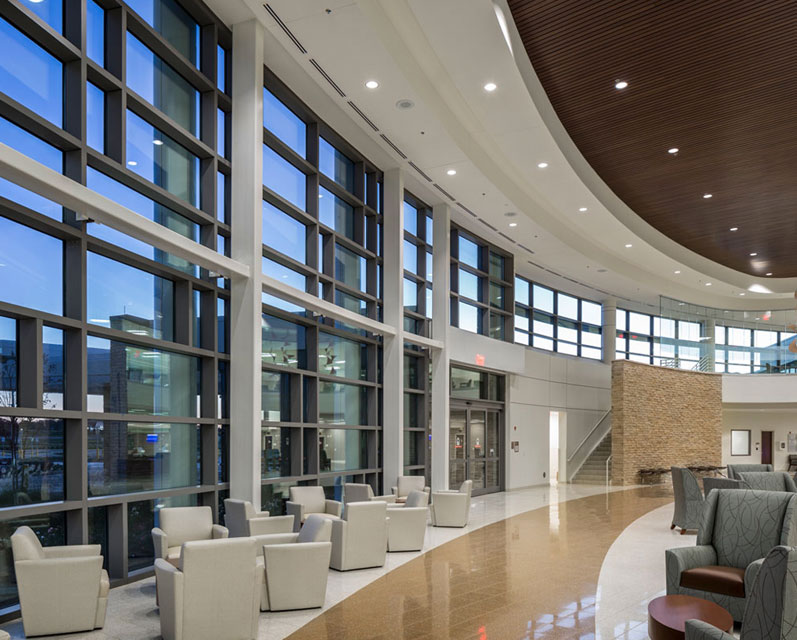 lobby of GSA office space. Circular office lobby with many windows, modern architecture and modern furniture.
